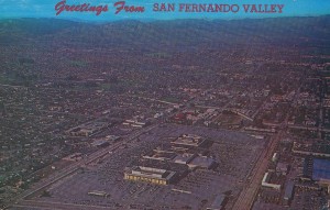Aerial view of Canoga Park, looking north, with Topanga Canyon Shopping Center in foreground. Circa 1970.